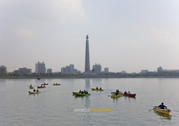 Boats on the Taedong river with the Juche tower in the background, Pyongan Province, Pyongyang, North Korea