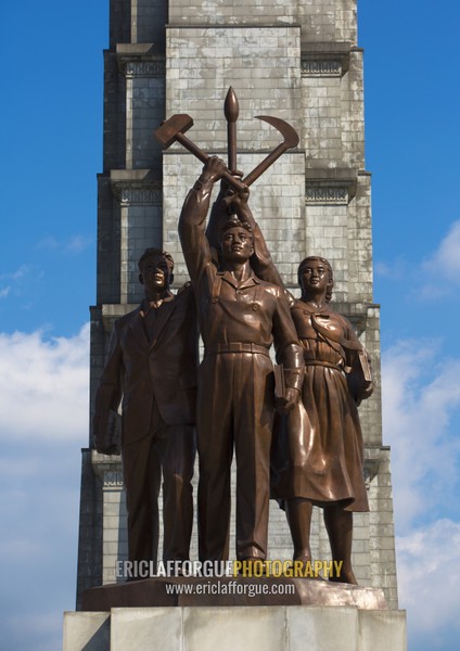 Bronze statues at the bottom of the Juche tower built to commemorate Kim il-sung's 70th birthday, Pyongan Province, Pyongyang, North Korea