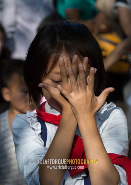 North Korean girl dancing in a park on september 9 day of the foundation of the republic, Pyongan Province, Pyongyang, North Korea