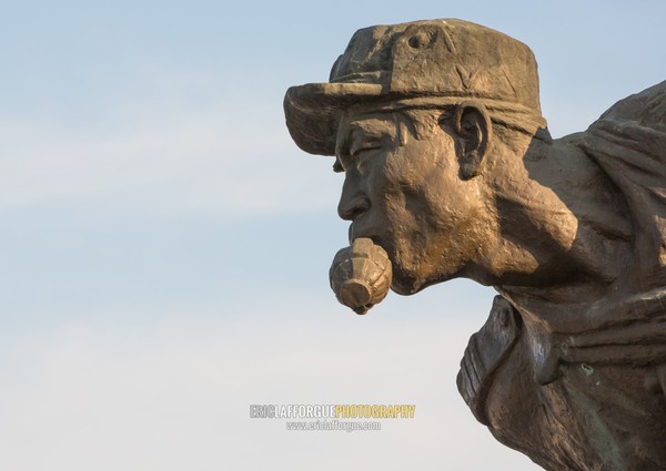 Statue of a soldier with a grenade in the mouth at the entrance to the victorious fatherland liberation war museum, Pyongan Province, Pyongyang, North Korea