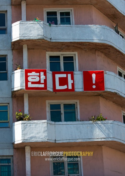 Propaganda slogan on old apartements in the city center, Kangwon Province, Wonsan, North Korea