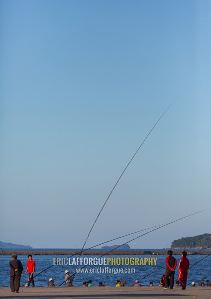 North Korean men fishing in the port, Kangwon Province, Wonsan, North Korea