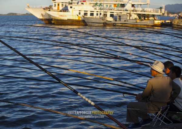 North Korean men fishing in the port, Kangwon Province, Wonsan, North Korea