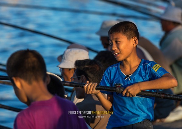 North Korean men fishing in the port, Kangwon Province, Wonsan, North Korea