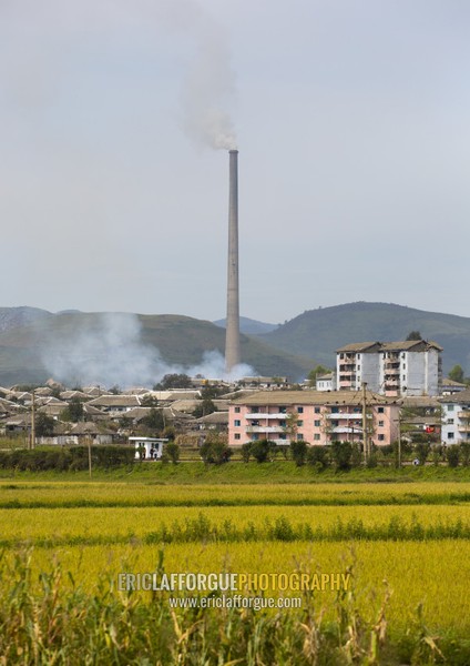 Giant factory chimney in a village, South Hamgyong Province, Hamhung, North Korea