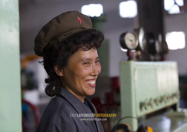 Smiling North Korean worker woman at Hungnam nitrogen fertilizer plant, South Hamgyong Province, Hamhung, North Korea