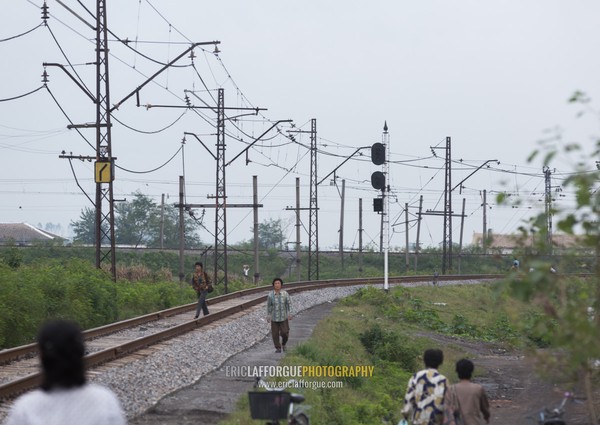 North Korea people walking on an empty railway, South Hamgyong Province, Hamhung, North Korea