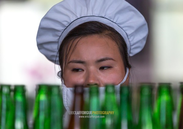 North Korean female worker in kangso yaksu mineral water factory, South Pyongan Province, Nampo, North Korea