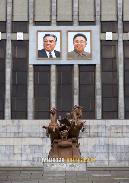 Kim il Sung and Kim Jong il giant portraits in front of Mangyongdae children's palace, Pyongan Province, Pyongyang, North Korea