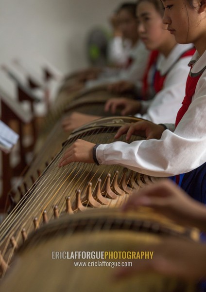 North Korean girls playing kayagum in Mangyongdae schoolchildren's palace, Pyongan Province, Pyongyang, North Korea