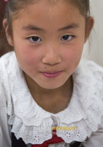 Portrait of a North Korean girl in Mangyongdae children's palace, Pyongan Province, Pyongyang, North Korea