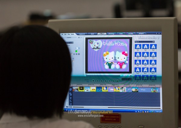 North Korean woman working on a computer for an editing classroom in Mangyongdae children's palace, Pyongan Province, Pyongyang, North Korea