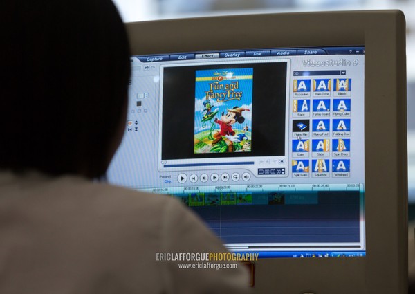 North Korean woman working on a computer for an editing classroom in Mangyongdae children's palace, Pyongan Province, Pyongyang, North Korea