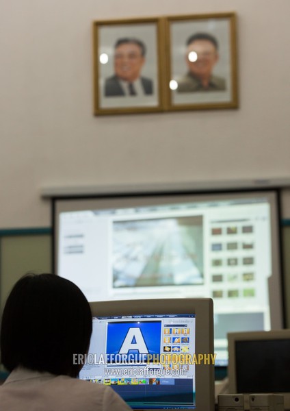 Video editing classroom under the portraits of the Dear Leaders in Mangyongdae children's palace, Pyongan Province, Pyongyang, North Korea