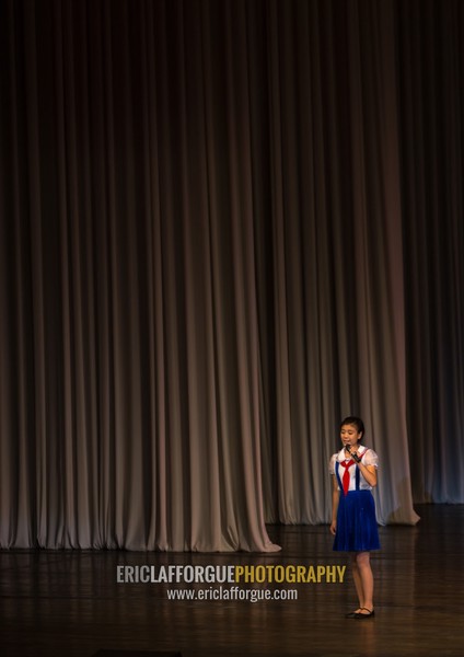 Young North Korean pioneer girl during a show in Mangyongdae children's palace, Pyongan Province, Pyongyang, North Korea