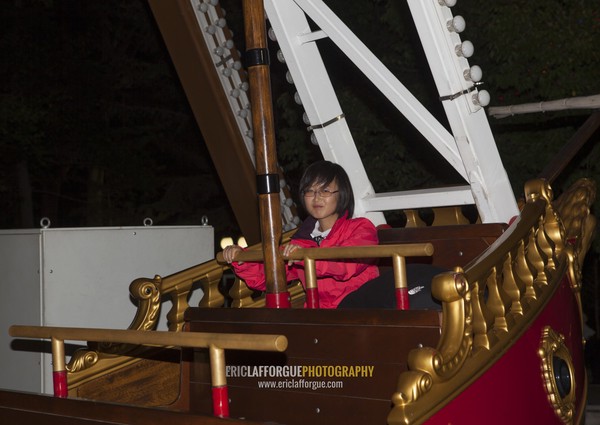 North Korean woman in a fairground attraction at Kaeson youth park, Pyongan Province, Pyongyang, North Korea