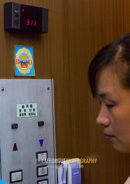 North Korean woman in an elevator which received an award in the Grand people's study house, Pyongan Province, Pyongyang, North Korea