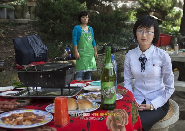 North Korean woman enjoying a picnic in a park on a sunday, Pyongan Province, Pyongyang, North Korea