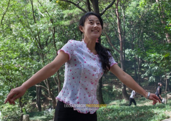 North Korean woman dancing in a park, Pyongan Province, Pyongyang, North Korea