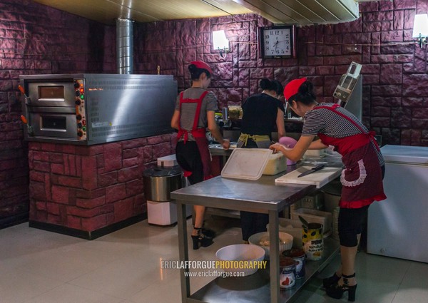 North Korean pizzeria cook in an italian restaurant, Pyongan Province, Pyongyang, North Korea