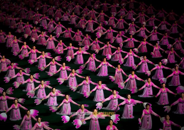 North Korean women dancing in choson-ot during the Arirang mass games in may day stadium, Pyongan Province, Pyongyang, North Korea