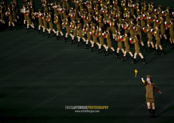 Sexy North Korean women dressed as soldiers dancing with swords during the Arirang mass games in may day stadium, Pyongan Province, Pyongyang, North Korea