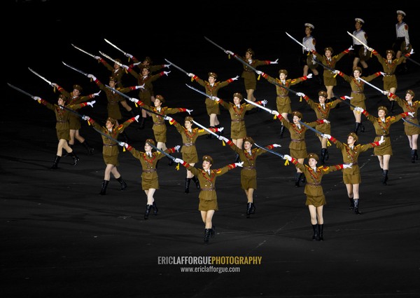 Sexy North Korean women dressed as soldiers dancing with swords during the Arirang mass games in may day stadium, Pyongan Province, Pyongyang, North Korea