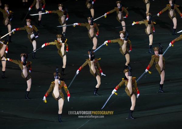 Sexy North Korean women dressed as soldiers dancing with swords during the Arirang mass games in may day stadium, Pyongan Province, Pyongyang, North Korea