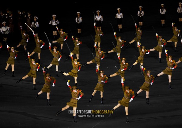 Sexy North Korean women dressed as soldiers dancing with swords during the Arirang mass games in may day stadium, Pyongan Province, Pyongyang, North Korea