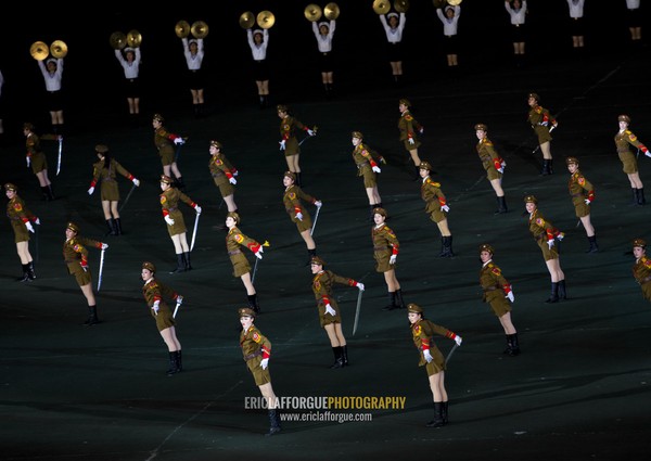 Sexy North Korean women dressed as soldiers dancing with swords during the Arirang mass games in may day stadium, Pyongan Province, Pyongyang, North Korea