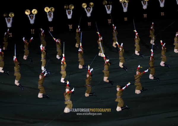 Sexy North Korean women dressed as soldiers dancing with swords during the Arirang mass games in may day stadium, Pyongan Province, Pyongyang, North Korea