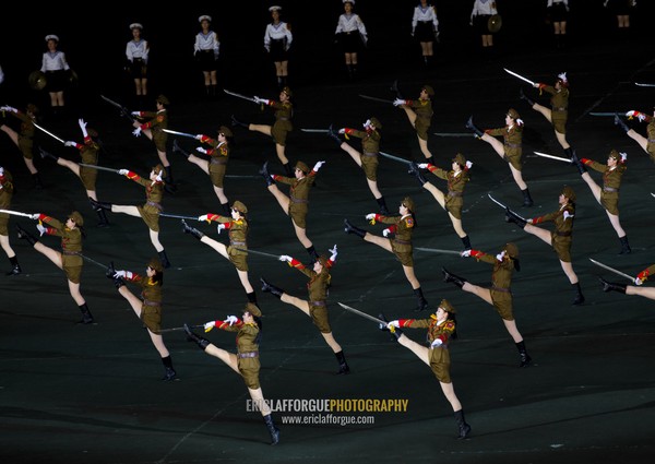 Sexy North Korean women dressed as soldiers dancing with swords during the Arirang mass games in may day stadium, Pyongan Province, Pyongyang, North Korea