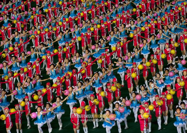 North Korean children performing with balloons during the Arirang mass games in may day stadium, Pyongan Province, Pyongyang, North Korea