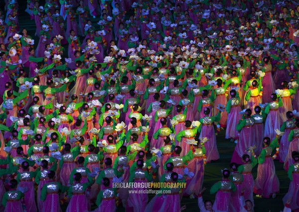 North Korean women dancing in choson-ot during the Arirang mass games in may day stadium, Pyongan Province, Pyongyang, North Korea