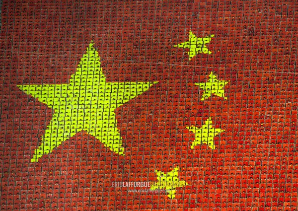 China flag made by children pixels holding up colored boards during Arirang mass games in may day stadium, Pyongan Province, Pyongyang, North Korea